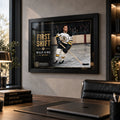 Black framed Willie O'Ree wall art displayed in a modern office, bringing hockey collector character to a professional space.