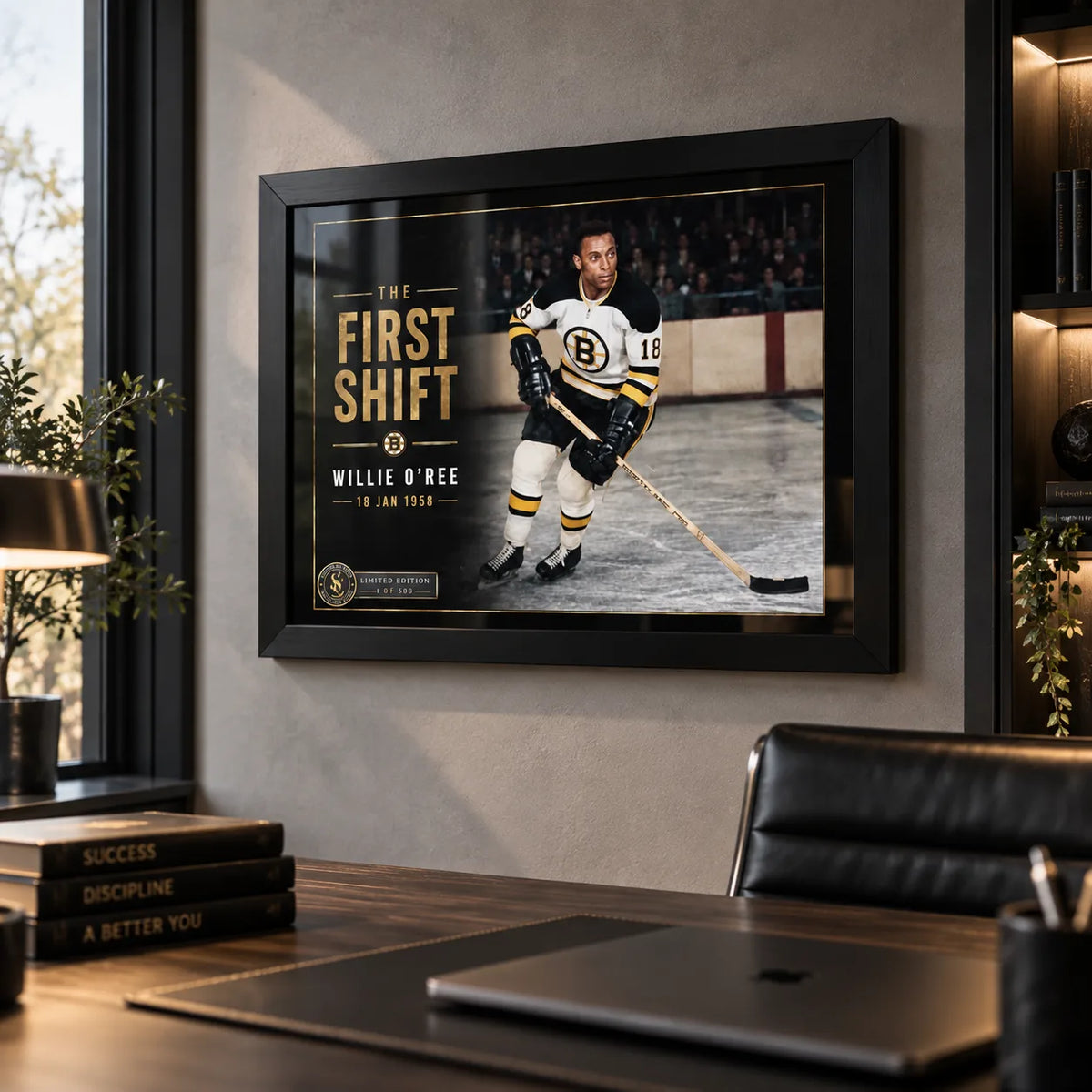 Black framed Willie O'Ree wall art displayed in a modern office, bringing hockey collector character to a professional space.