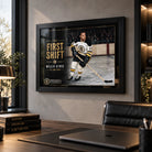Black framed Willie O'Ree wall art displayed in a modern office, bringing hockey collector character to a professional space.