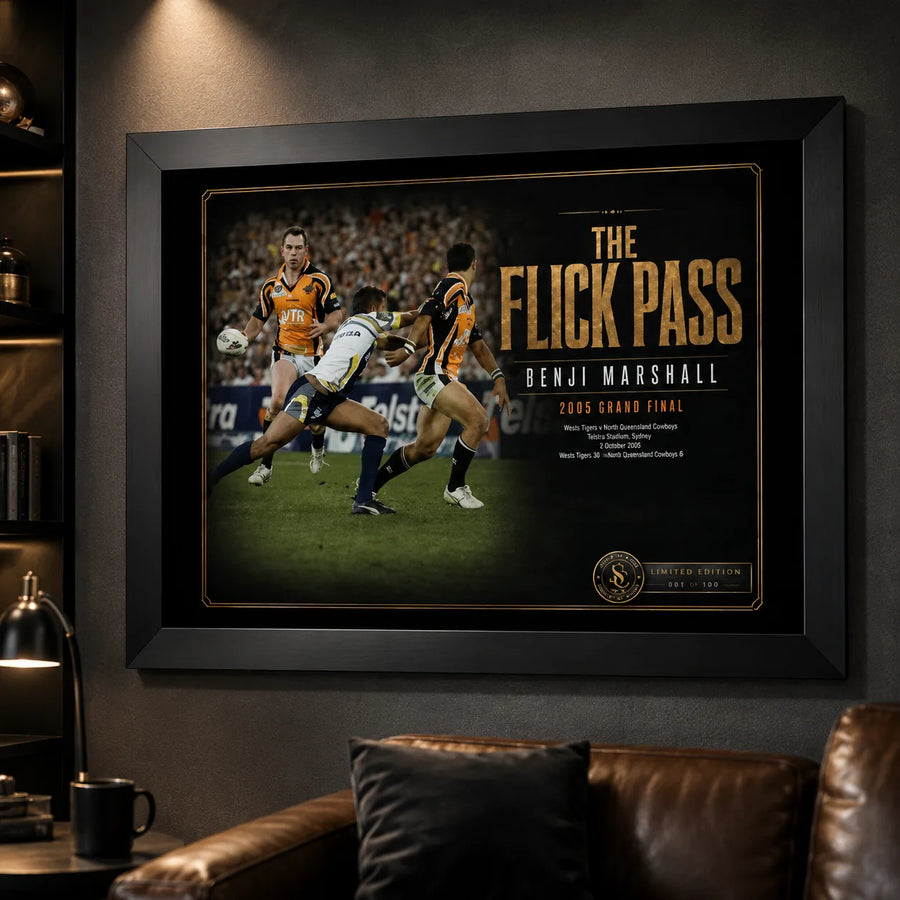 Benji Marshall wall art displayed in a dark man cave, featuring The Flick Pass artwork in a black frame.