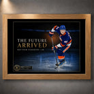 Oak framed Matthew Schaefer hockey wall art featuring The Future Arrived design against a dark gallery-style wall.