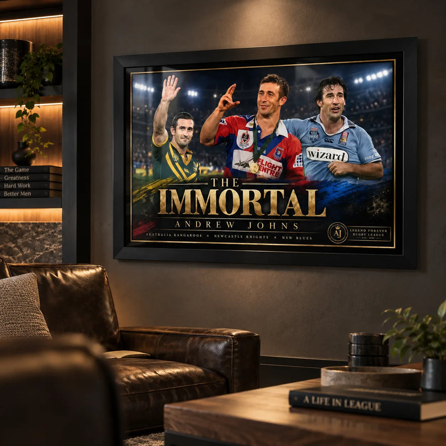 Black framed Andrew Johns rugby league wall art displayed in a dark premium man cave with timber shelving and leather seating.