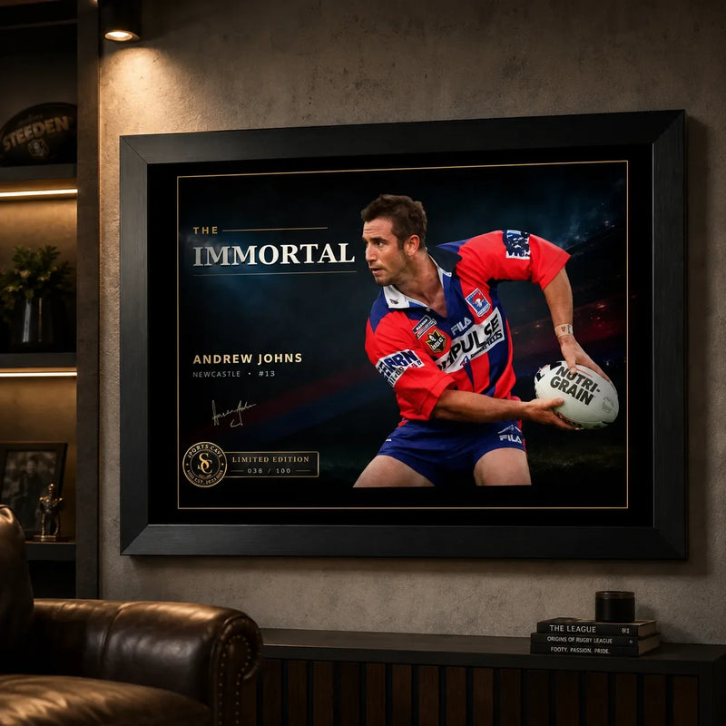 Andrew Johns wall art displayed in a dark man cave setting with the black framed The Immortal rugby league artwork as the focal point.