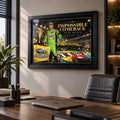 Kyle Busch NASCAR wall art displayed in a modern office, black framed above a desk with warm natural light.