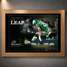 Oak framed The Leap Saquon Barkley wall art featuring the Philadelphia green football design.