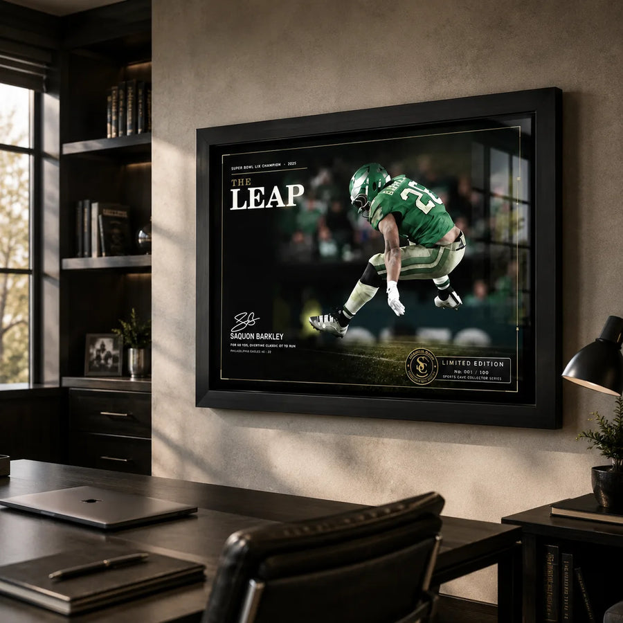 The Leap Saquon Barkley football wall art displayed in a modern office above a dark desk.