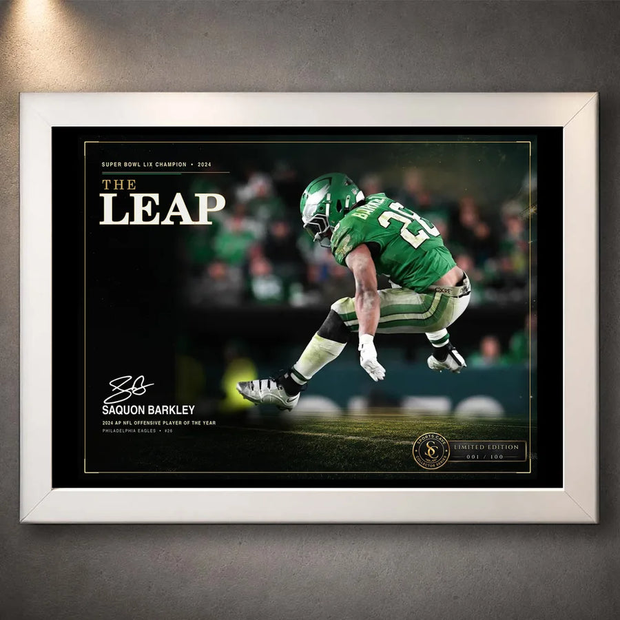 White framed The Leap Saquon Barkley wall art shown against a neutral wall for a clean collector presentation.