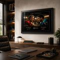 Joe Montana vs Dan Marino NFL wall art in a black frame above a desk in a warm wood-panelled office.
