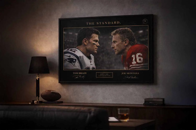Man cave wall décor showing framed sports memorabilia of Tom Brady vs Joe Montana, capturing iconic NFL greatness in a moody modern interior.