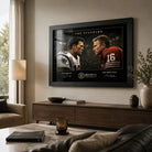 Black framed Tom Brady vs Joe Montana wall art displayed in a warm modern living room above a timber console.