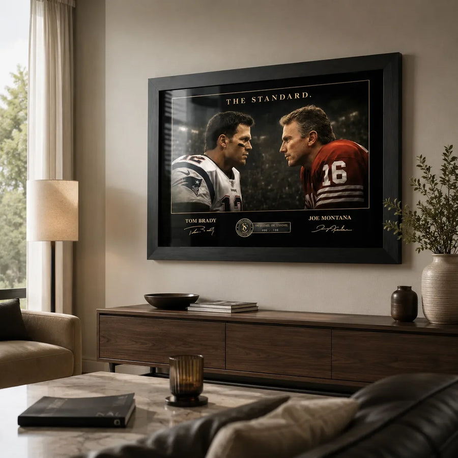 Black framed Tom Brady vs Joe Montana wall art displayed in a warm modern living room above a timber console.