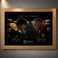 Bobby Orr and Gordie Howe face-off artwork in a natural oak frame with black-and-gold collector styling.