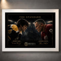 Bobby Orr and Gordie Howe face-off artwork in a clean white frame with premium black-and-gold styling.