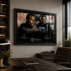 The Ultimate Backfield Bo Jackson and Marcus Allen wall art displayed in a modern office above a dark wood desk.