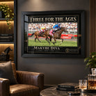 Makybe Diva horse racing wall art displayed in a dark man cave with warm shelving and leather seating.