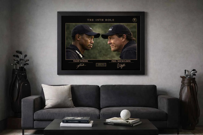 Tiger Woods and Phil Mickelson framed sports wall art displayed above modern sofa in stylish golf-themed man cave setting