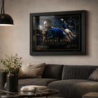 Black framed Tim Cahill Everton wall art displayed above a dark sofa in a premium living room setting.