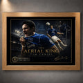 Tim Cahill Everton wall art shown in an oak frame with black mat border and gold collector details.