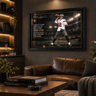 Tom Brady NFL wall art in a black frame displayed in a dark man cave with leather seating and warm shelf lighting.