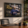 Black-framed Tony Gwynn Mr. Padre tribute mounted above the desk in a home office with a leather chair.