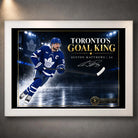 White framed Auston Matthews hockey wall art featuring Toronto's Goal King artwork for a clean sports room display.