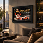 Alan Kulwicki Underbird NASCAR wall art hanging in a contemporary living room with city views at sunset.