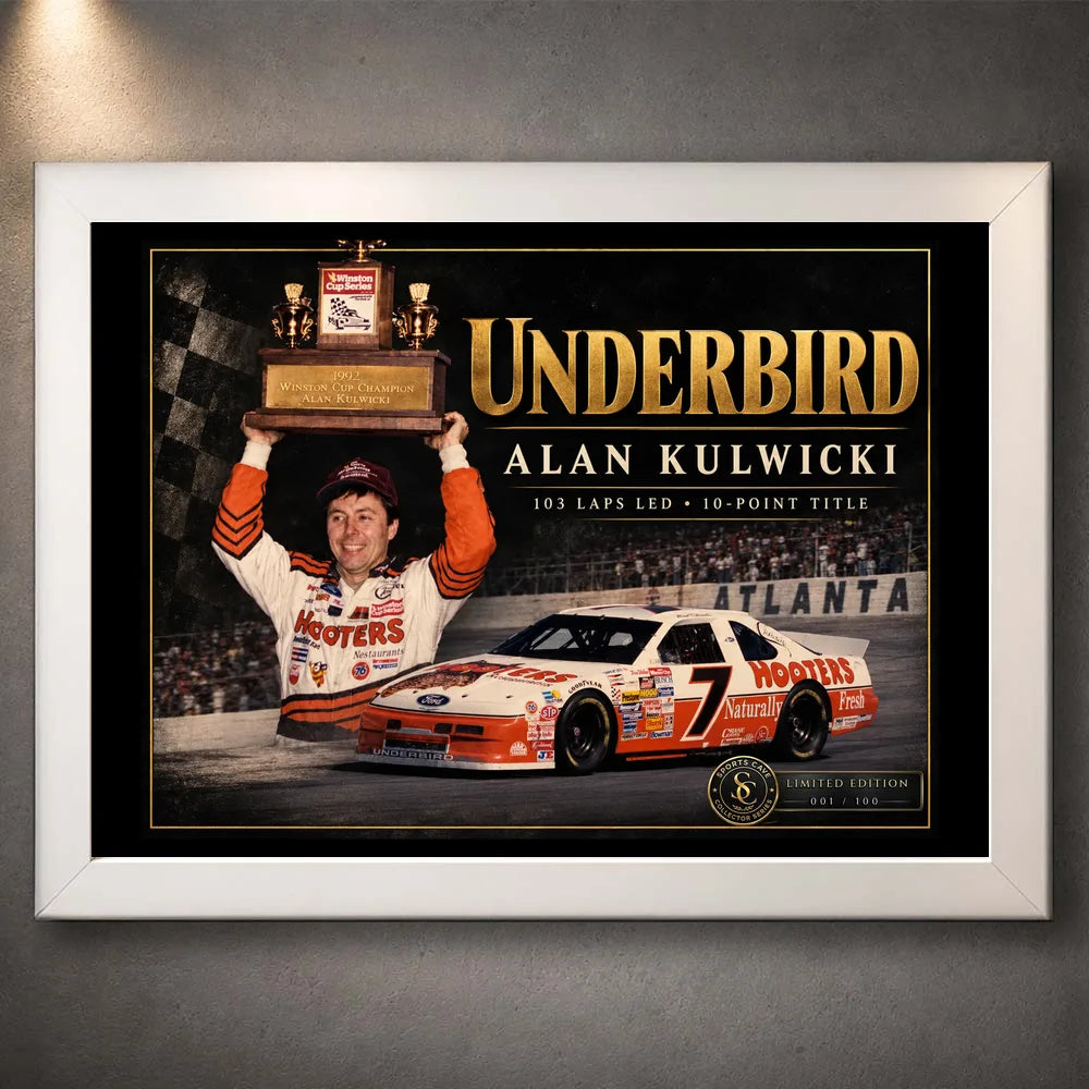 White framed Alan Kulwicki Underbird NASCAR wall art depicting his trophy celebration and number 7 stock car.