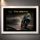 White framed Valentino Rossi The Doctor wall art featuring the #46 motorcycle racing through spray.