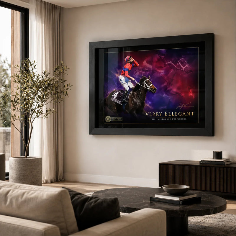 Black framed Verry Elleegant 2021 Melbourne Cup wall art displayed in a bright modern living room with neutral furnishings.
