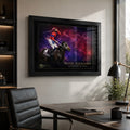Black framed Verry Elleegant 2021 Melbourne Cup wall art displayed in a modern home office above a dark timber desk.