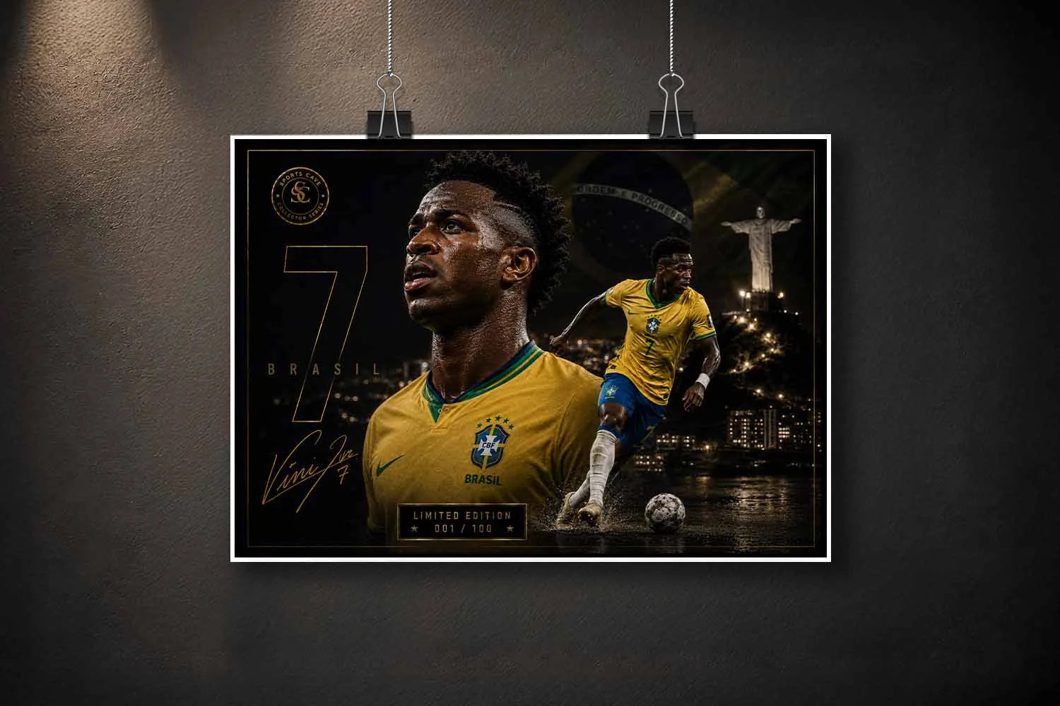 Unframed Vinicius Junior Brazil sports art print suspended with clips against a dark textured wall backdrop.