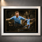 Kevin De Bruyne Manchester City soccer wall art in a white frame with black mat border.
