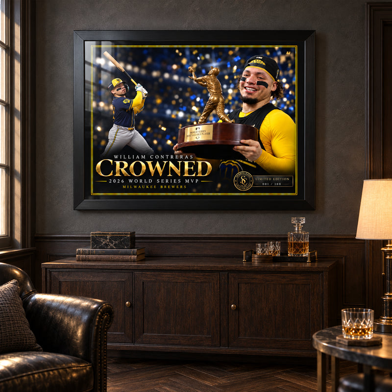 William Contreras Crowned edition in a black frame above a dark timber cabinet in a collector lounge.