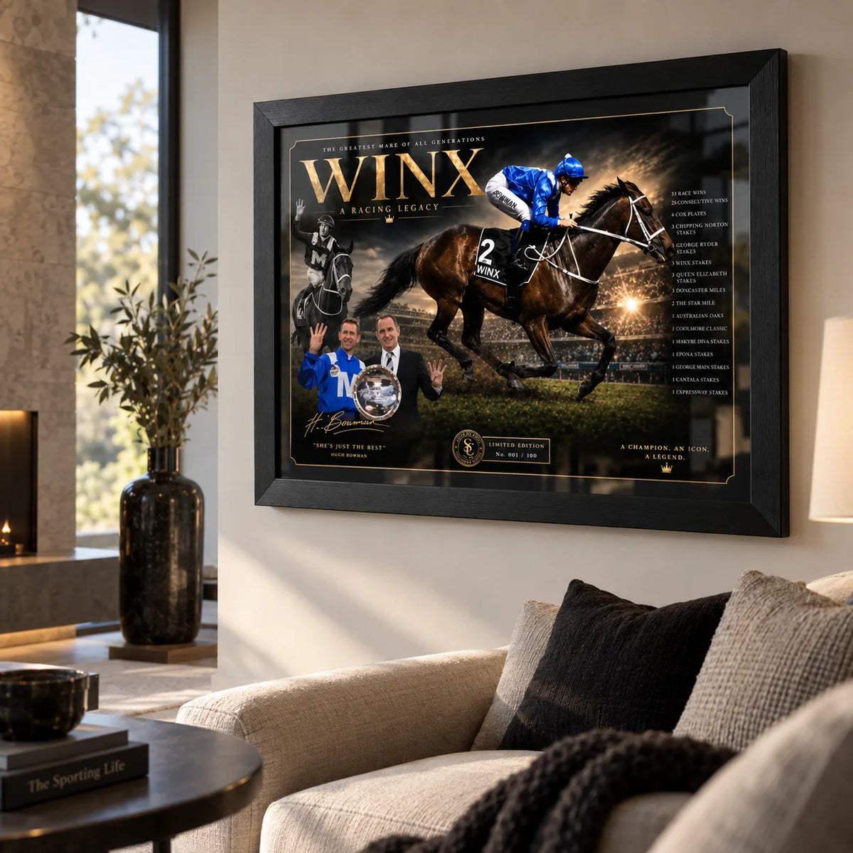 Winx black framed horse racing wall art displayed in a bright modern living room above a neutral sofa and black accents.