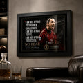 Black framed Zlatan Ibrahimovic soccer wall art displayed on a dark man cave wall above leather seating.