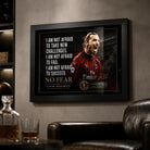 Black framed Zlatan Ibrahimovic soccer wall art displayed on a dark man cave wall above leather seating.